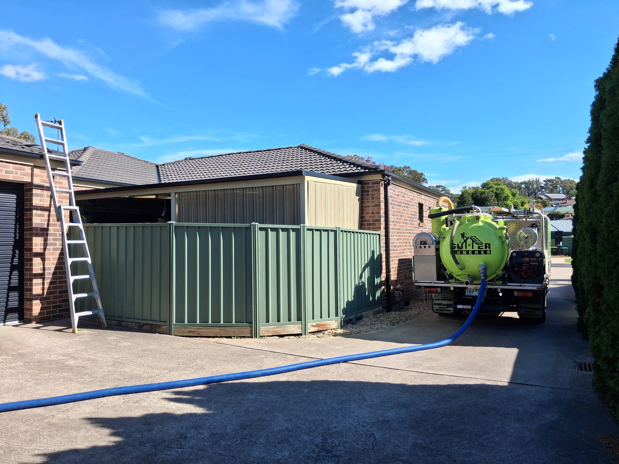 Gutter Muncher team cleaning gutters at Kangaroo Flat unit complex